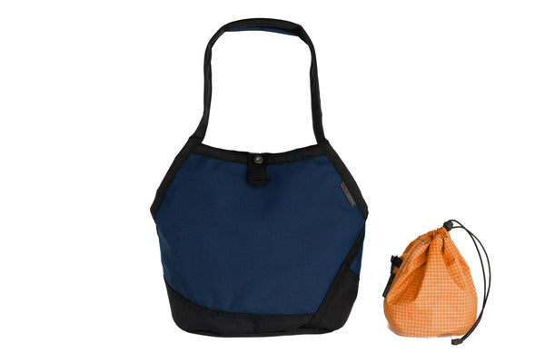A Swift in Deep Blue (dark blue) Ballistic with Zest (orange with white grid) 200 Halcyon interior and Yarn Stuff Sack.